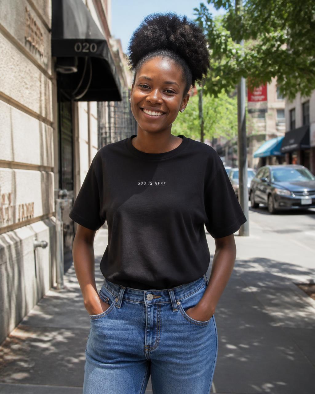 Woman wearing the black GOD IS HERE tee