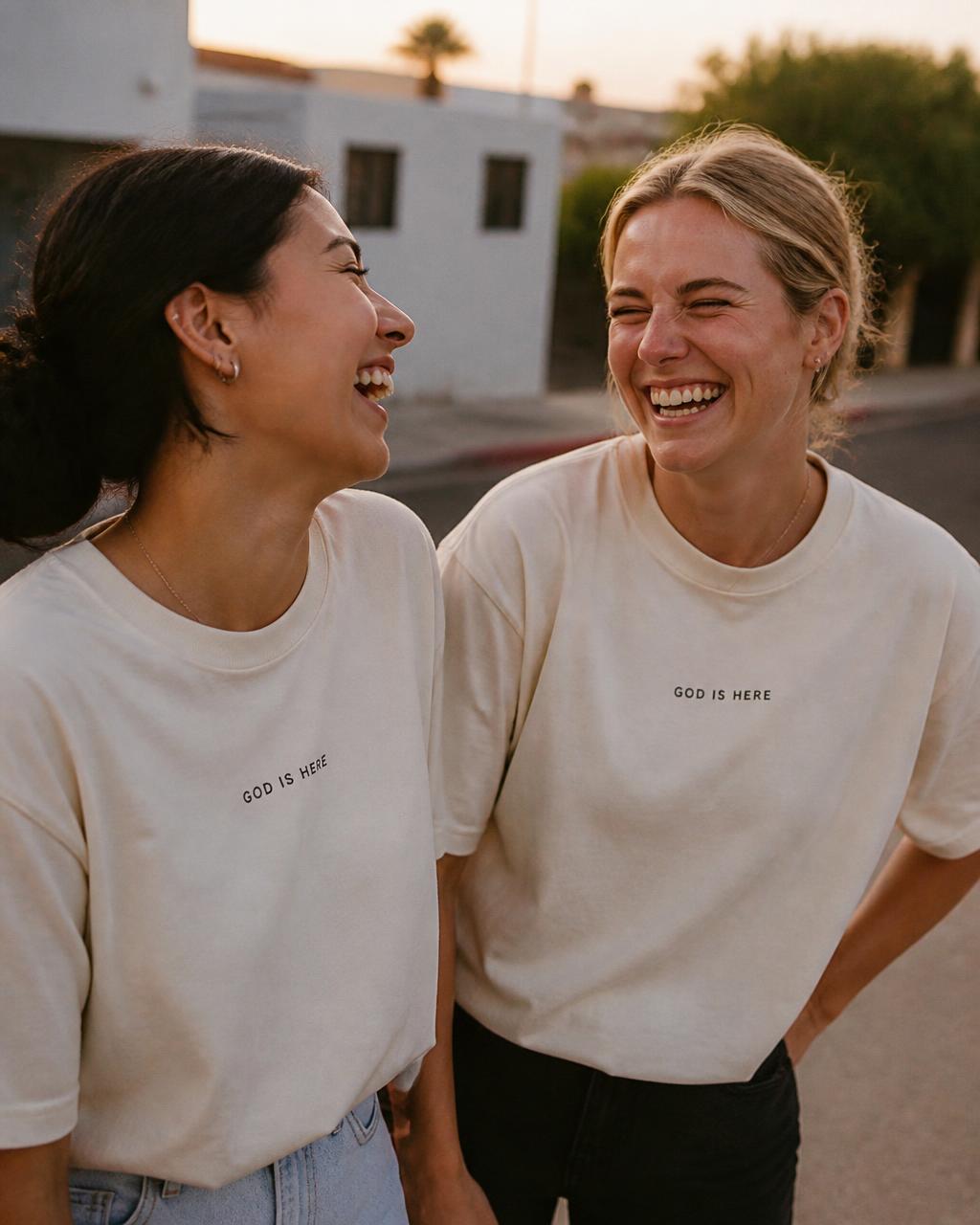 Friends wearing cream GOD IS HERE tees